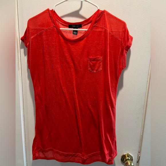 reddish orange shirt